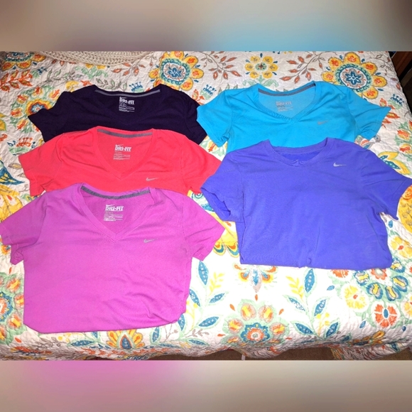 Nike Tops - A bundle of 5 Nike dri-fit ladies tank tops in a size small.
